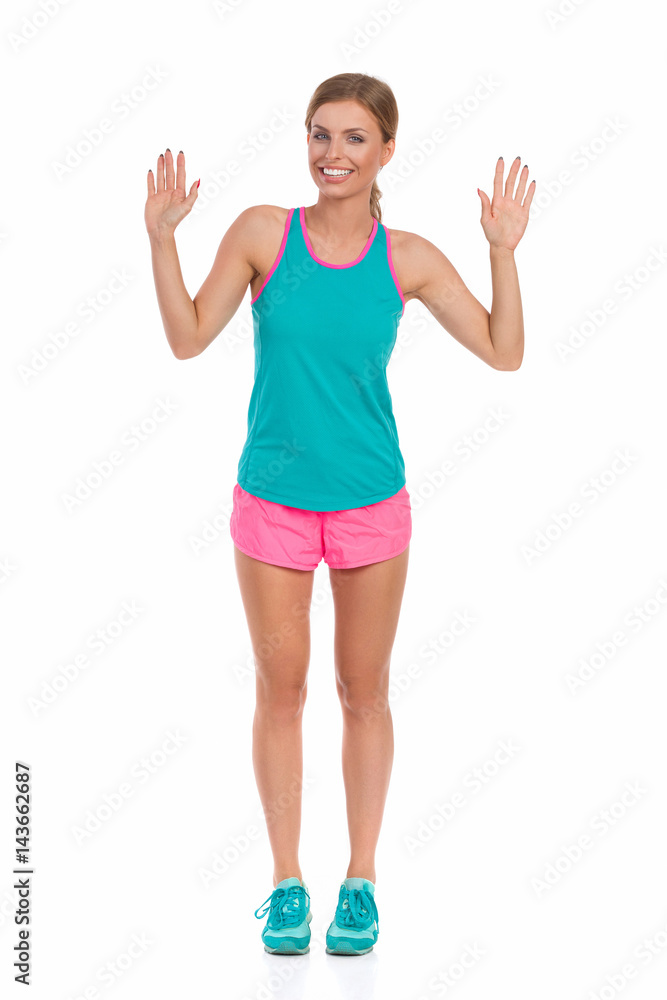 Woman In Vibrant Sport Clothes Showing Ten Fingers Woman In Vibrant Sport Clothes Showing Ten Fingers