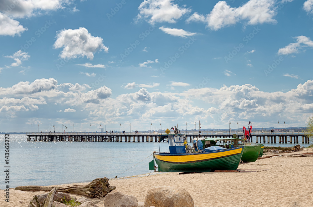 Fototapeta premium Fishing boats on the shore of the beach in Orłowo