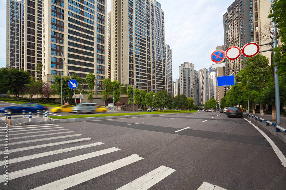 Fototapeta premium Empty road surface floor with City streetscape buildings