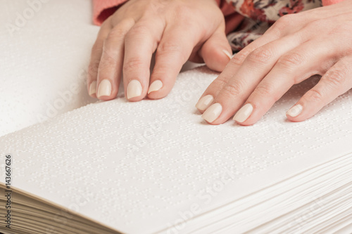 Books Braille. The touch of your fingertips the texture of the paper  reading the sign. Reading the book blind man.
