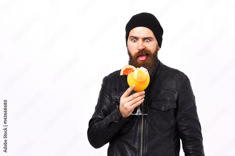 Brutal caucasian hipster holding alcoholic beverage or fresh cocktail Brutal caucasian hipster holding alcoholic beverage or fresh cocktail
