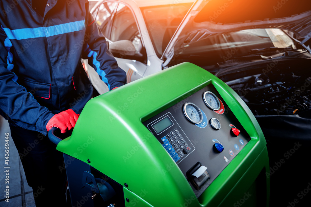 Fototapeta premium Servicing car air conditioner. Service station.