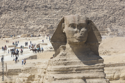 Closeup view of the Sphinx head with pyramid in Giza near Cairo, Egypt