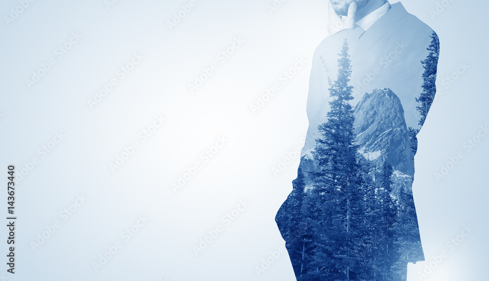 Businessman standing with mountain Businessman standing with mountain