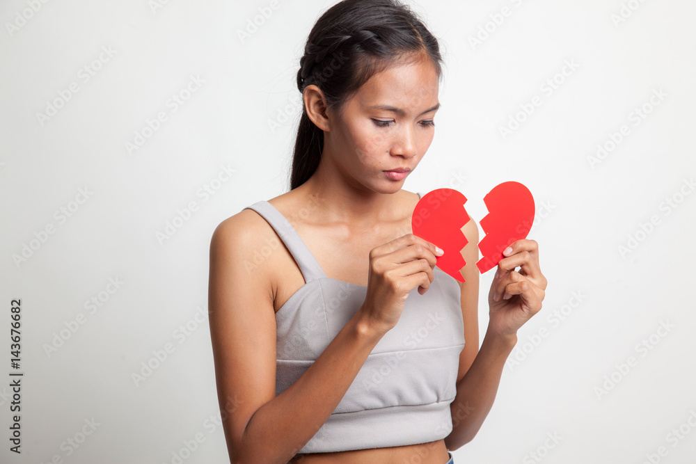 Beautiful young Asian woman with broken heart. Beautiful young Asian woman with broken heart.