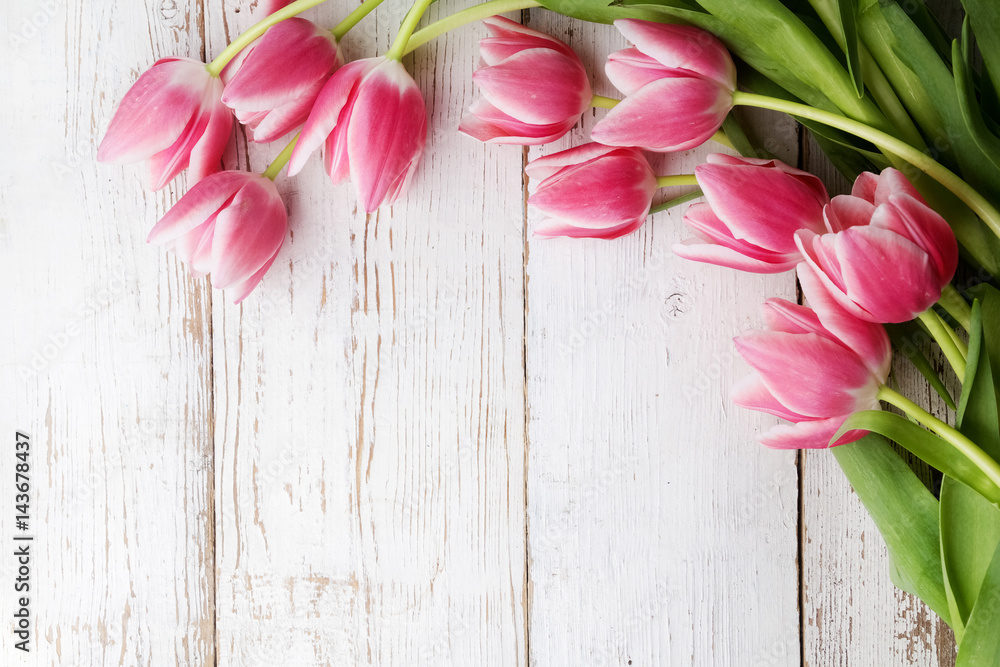 beautiful tulips on wooden background. Top view