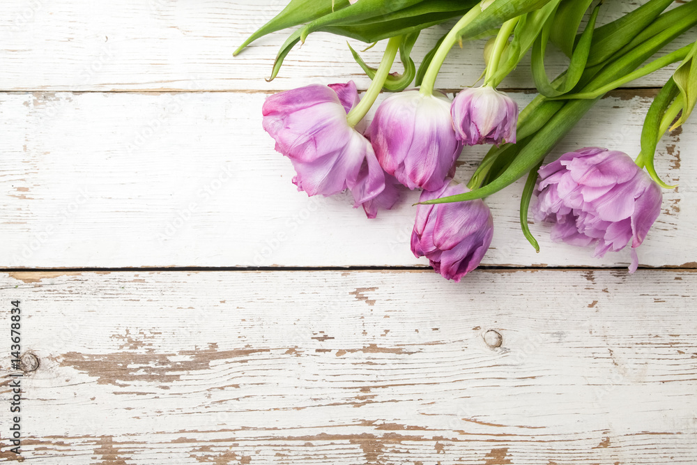 beautiful tulips on wooden background. Top view