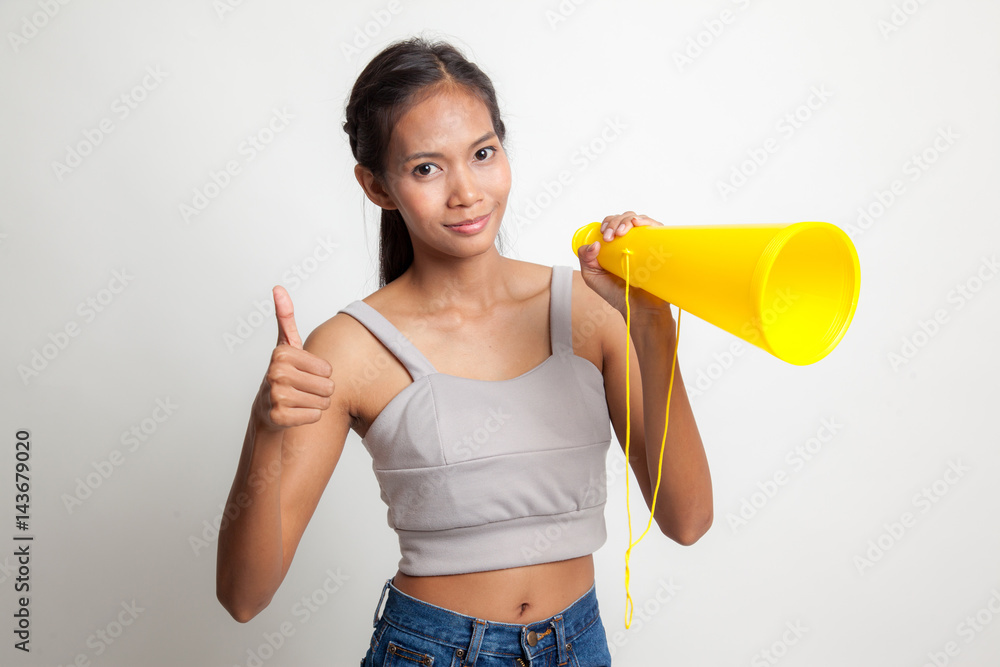 Beautiful young Asian woman show thumbs up announce with megaphone. Beautiful young Asian woman show thumbs up announce with megaphone.