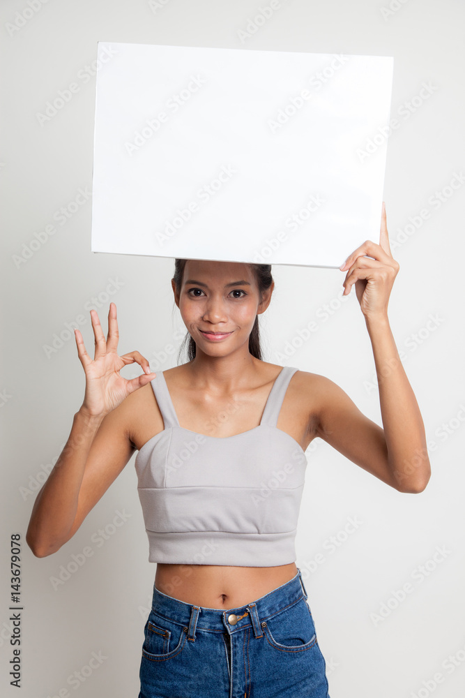 Young Asian woman show OK with white blank sign. Young Asian woman show OK with white blank sign.