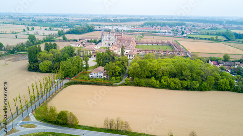 Vista aerea della Certosa di Pavia, costruita alla fine del XIV secolo,  campi e chiostro del monastero e santuario in provincia di Pavia, Lombardia, Italia photo