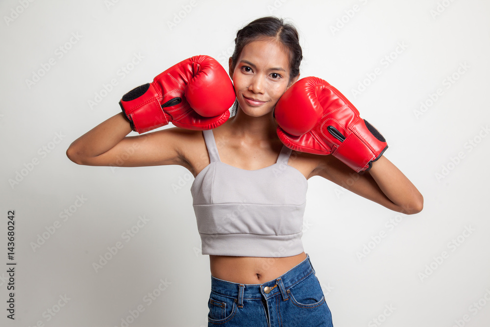 Young Asian woman with red boxing gloves. Young Asian woman with red boxing gloves.