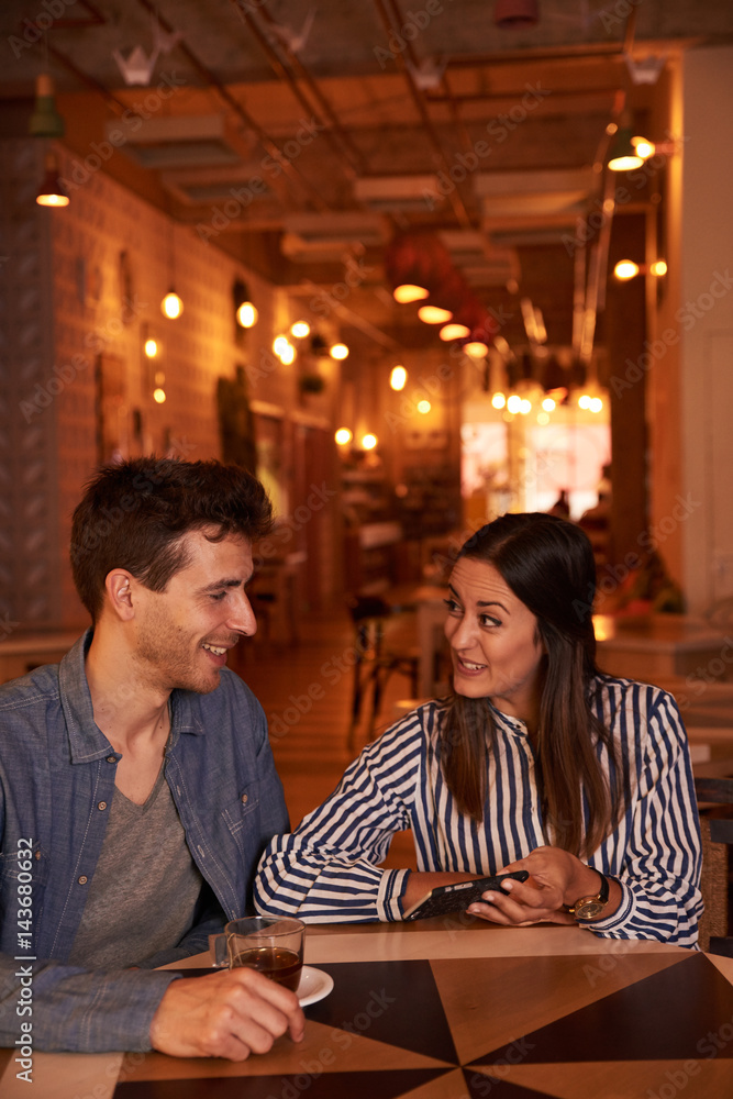 Fototapeta premium Intimate loving millenal couple smiling secretely