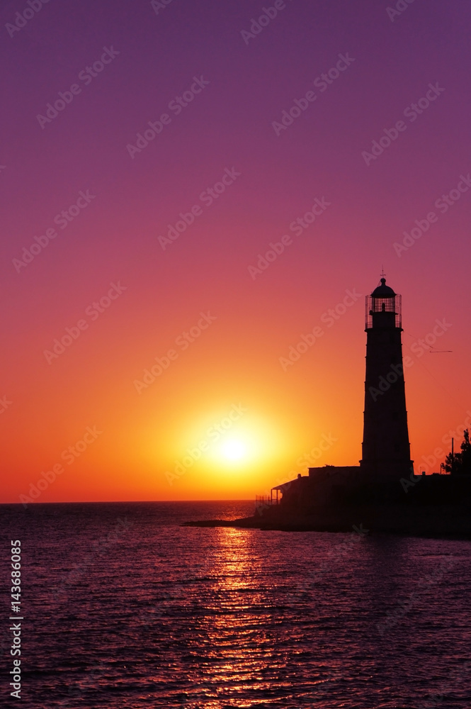 Lighthouse on the black sea. Crimea. Sunset