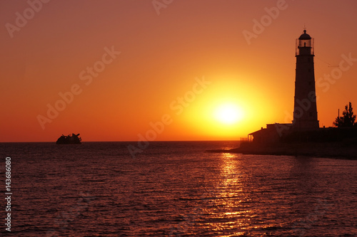 Lighthouse on the black sea. Crimea. Sunset