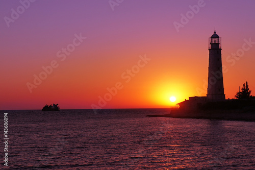 Lighthouse on the black sea. Crimea. Sunset © Mak
