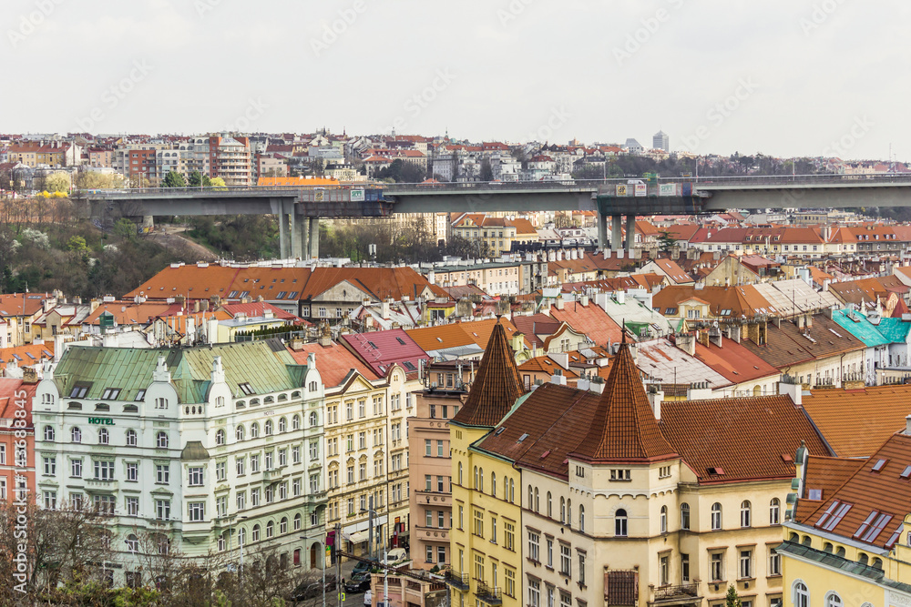 Obraz premium The view from Vyshegrad rock to city of Prague in the early spring on a sunny day. Area of the old town in Prague, Czech Republic.