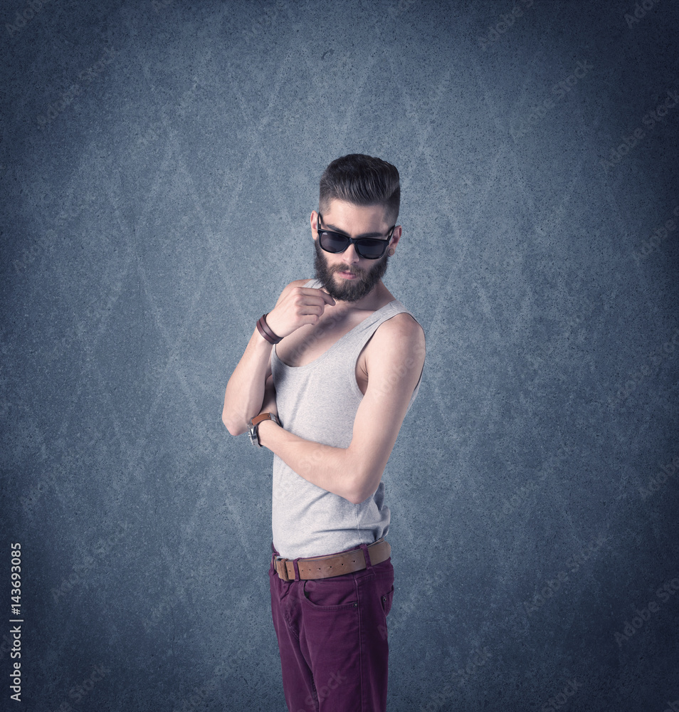 Bearded hipster standing in elegant clothes Bearded hipster standing in elegant clothes