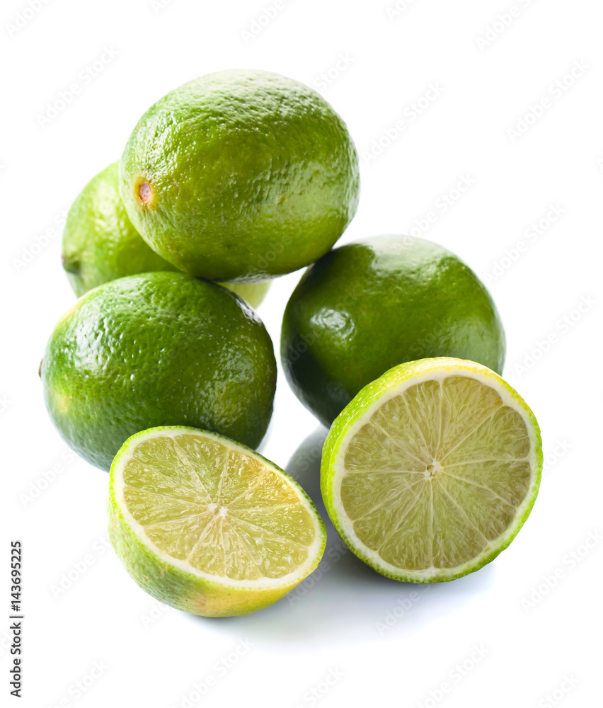 Group of whole and cut fresh limes over white background Group of whole and cut fresh limes over white background
