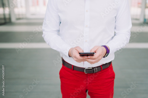 Man using a smartphone. Modern digital concept. Close-up corporate smartphone approach.