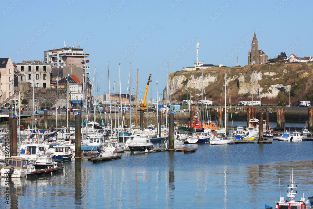 The view of the Church and of the yacht in the French town of Dieppe.