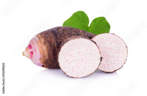 A taro and green leaf, sliced taro isolated on white background photo