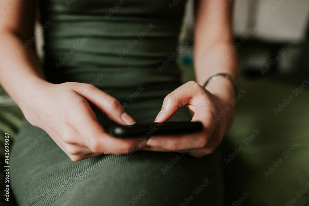 Woman using mobile smartphone. Modern or artistic concept. Close-up vintage smartphone approach.