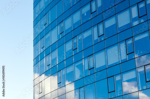 Modern office building  with a clean view of the sky. Economic and financial concept. Facade glass building background and sky view.
