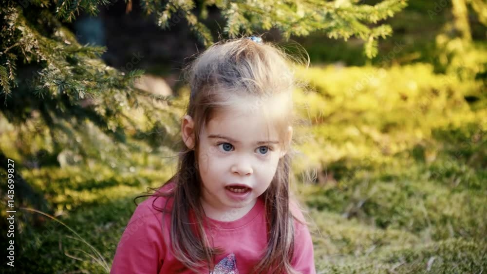 Lovely girl playing in the forest Lovely girl playing in the forest
