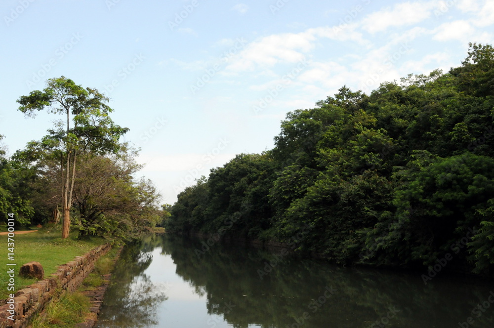 River in the garden near mountain of Sigiriya. River in the garden near mountain of Sigiriya.