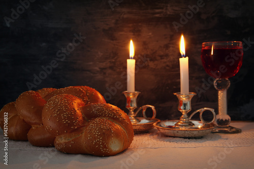shabbat image. challah bread, shabbat wine and candles