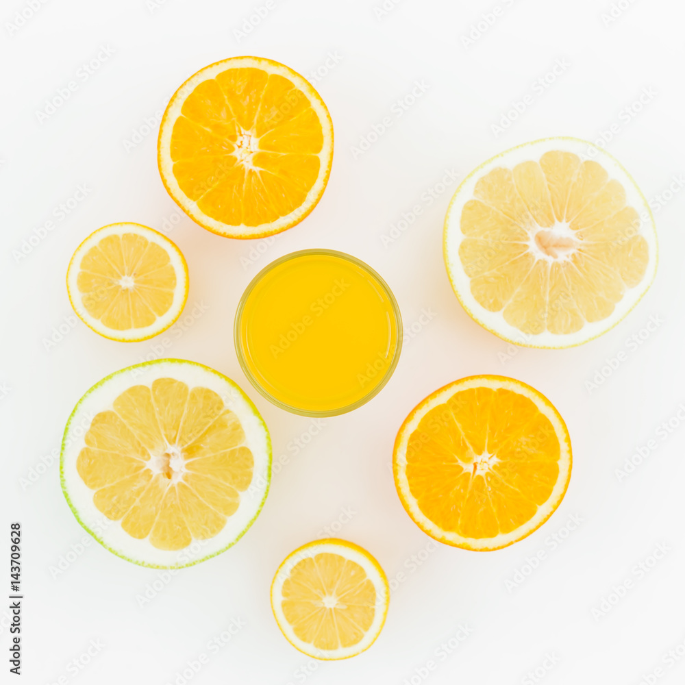 Citrus fruits and juice made of lemon, orange, sweetie isolated on white background. Flat lay, top view. Summer background