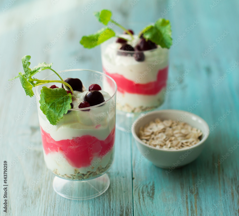 Berry dessert, smoothies with oatmeal, yogurt and cream. The concept of a healthy diet Berry dessert, smoothies with oatmeal, yogurt and cream. The concept of a healthy diet