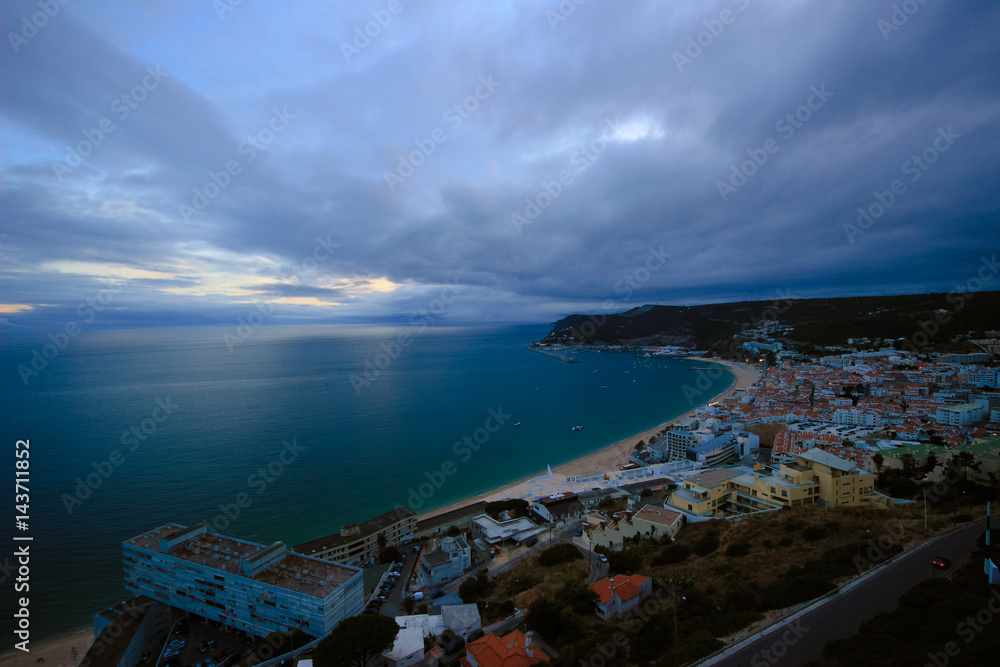 Beautiful view of Sesimbra beach in Portugal at the sunset
