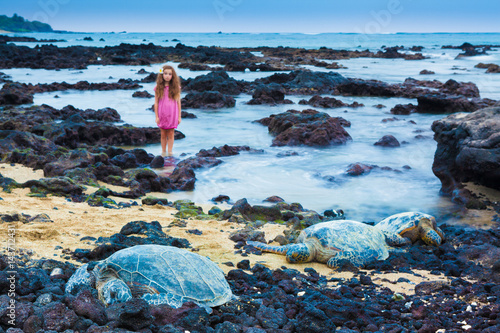 Little girl and green sea turtles © georgeburba