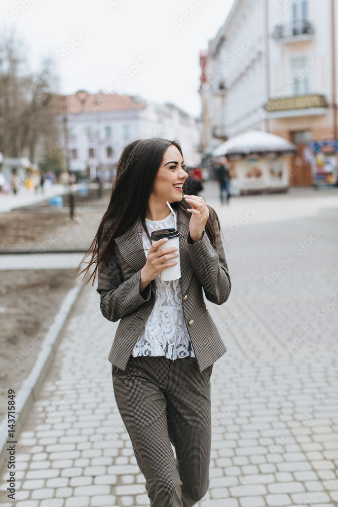 Fototapeta premium Business women walking on the street and drinking coffee.