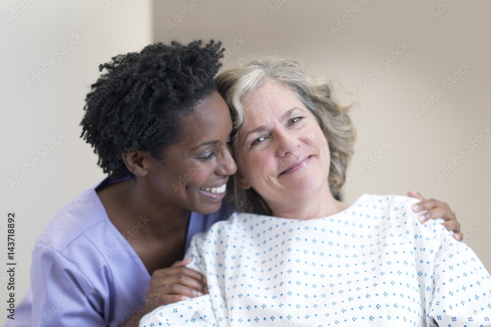 Nurse comforting female patient Nurse comforting female patient