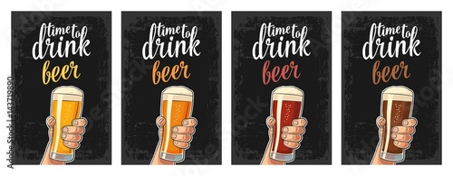 Male hand holding a glass with four types beer - light, white, red and dark.
