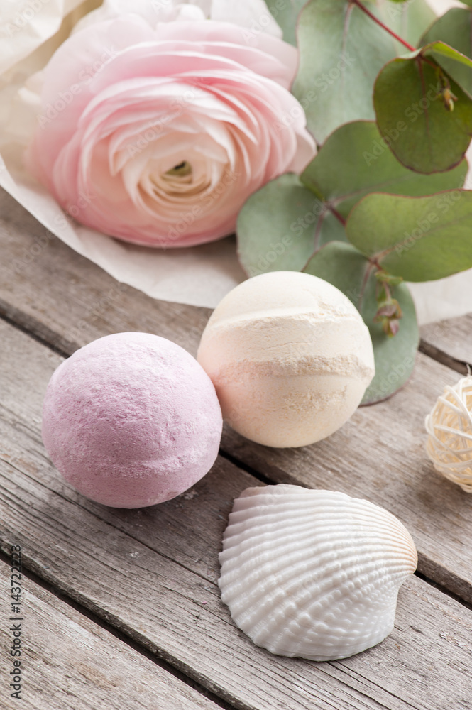 Bath bombs on old wooden background