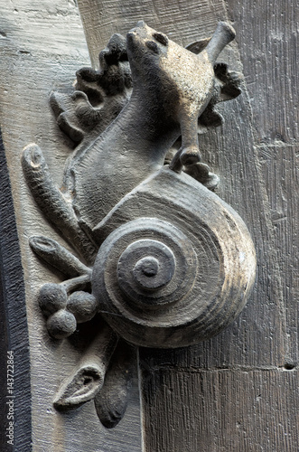 Gothic art. Stone sculpture of a snail on fasade of Town hall building in Munich,Bavaria,Germany