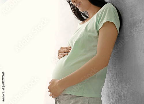 Beautiful pregnant woman st...