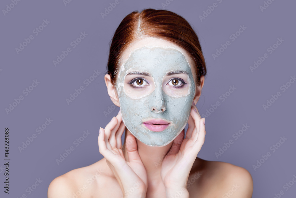 photo of beautiful young woman with mask on her face on the wonderful grey background photo of beautiful young woman with mask on her face on the wonderful grey background