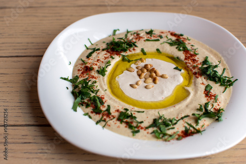 Chickpea hummus with olive oil and pine nuts