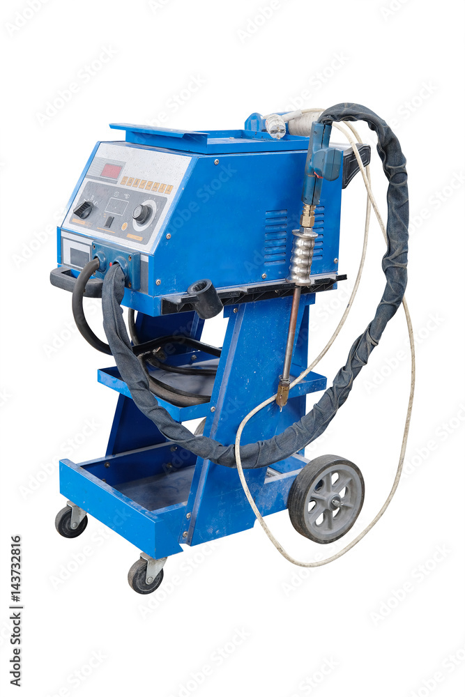 Car repair station with welder jn a frontground Car repair station with welder jn a frontground