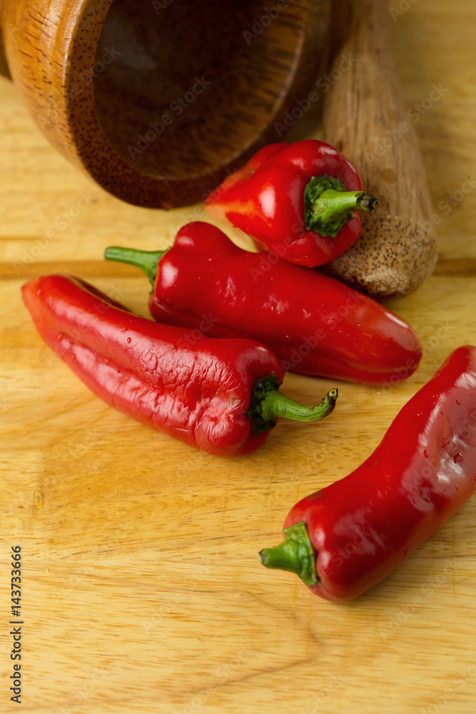 red hot chilli peppers on wooden background. Selective focus