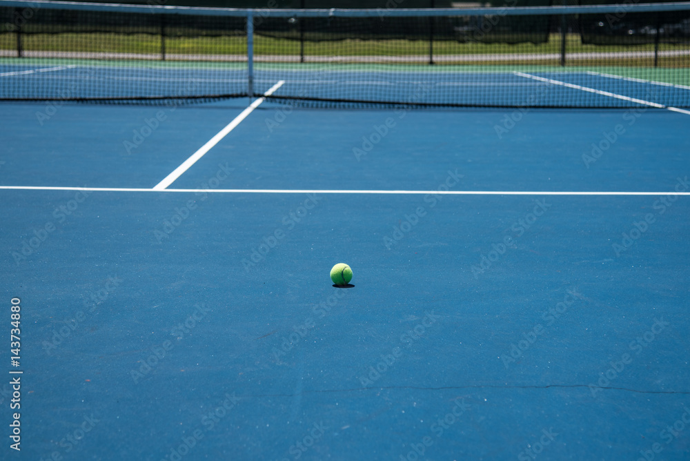 Tennis court and yellow tennis ball
