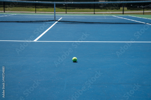 Tennis court and yellow tennis ball