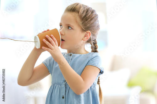 Cute little girl using plas...