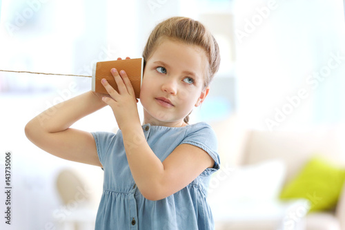 Cute little girl using plas...