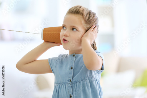 Cute little girl using plas...