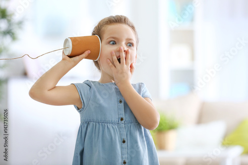 Cute little girl using plas...